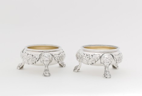 Pair of Salts, 1790/95. Legs in the form of a human face with stylised dolphin or fish at the foot.