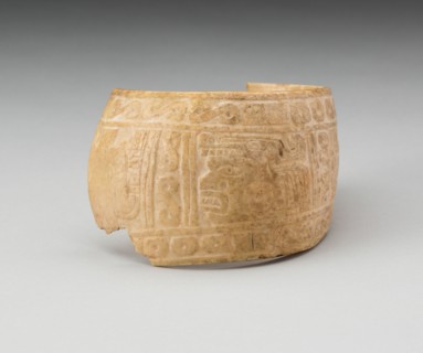 Shell, Possibly an Arm Band, Incised with Profile Head Framed by Geometric Motifs (Fragment), c. A.D. 1200.