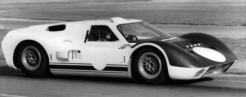 British racing driver and engineer Ken Miles driving a 1966 Ford GT40 J racing car. Creator: Unknown.