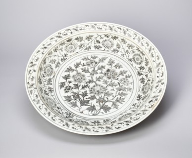 Shallow Dish with Peony Scrolls, Chrysanthemum Spray, and Key-Fret Border; Lotus Petal under Rim. Ming dynasty (1368-1644), late 14th century.