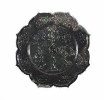 Lobed Mirror with Images of the Moon Palace Hare Pounding Elixir, Toad, and Chang E Holding Peaches of Immortality, Tang dynasty (A.D. 618-907), 8th century.