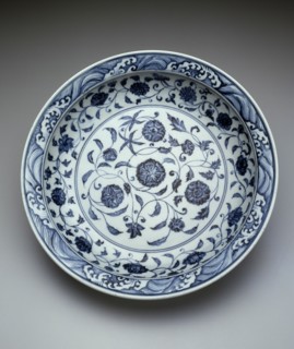 Dish with Scrolling Flowers and Breaking Waves, Ming dynasty (1368-1644), early 15th century.