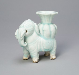 Joss-Stick Holder in the Form of an Elephant Holding a Lobed Vase, Yuan dynasty (1271-1368).
