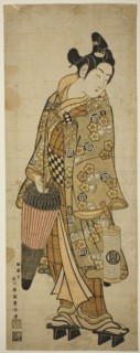 The Actor Sanogawa Ichimatsu I as a young man holding an umbrella and a lantern, c. 1748.