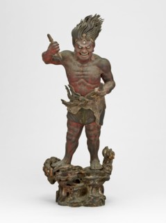 Shukongojin, Kamakura Period, 12th/14th century. A wooden sculpture of a muscular red figure with flaming hair and a third eye, stares fiercely down at us. Left head raised over head holds a vajra, a ...