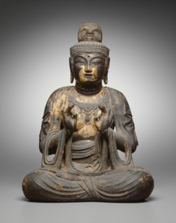Seated Bodhisattva, 8th century. Seated wooden Buddha statue with with forefinger touching thumb.