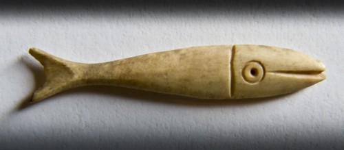 Detail of a fish-shaped bone gaming piece from Portchester Castle, Fareham, Hampshire, 2009. Creator: Derek Kendall.