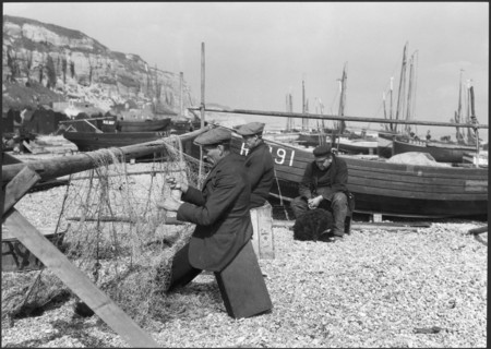 Fishermen mending nets on the beach, Hastings, East Sussex, 1925-1939. Creator: J Dixon Scott.