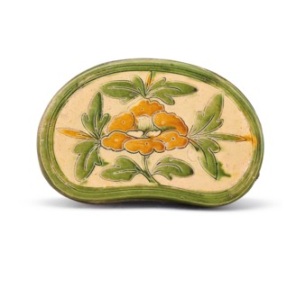 A sancai carved "peony" pillow, Between 960 and 1127. Creator: The Oriental Applied Arts.