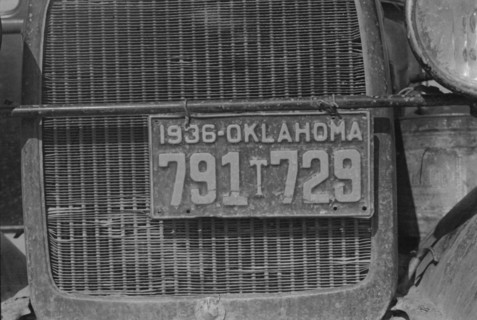 Radiator and license of Oklahoma cotton picker's car, San Joaquin Valley, California, 1936. Creator: Dorothea Lange.
