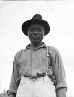 At Hill House, Mississippi - He wears the union button, 1936. Creator: Dorothea Lange.