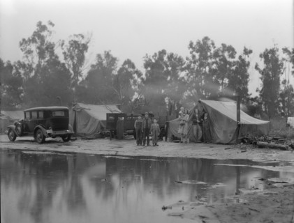 Migrant pea pickers camp in the rain, California, 1936. Creator: Dorothea Lange.