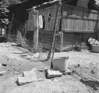 Home of Mexican field worker showing water supply, Brawley, Imperial Valley, California, 1935. Creator: Dorothea Lange.