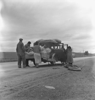Migrants, family of Mexicans, on road with tire trouble, looking for work..., CA, 1936. Creator: Dorothea Lange.