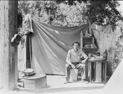 Jack Neill, "migratory fruit tramp," on banks of Pulah Creek near Winters, California, 1935. Creator: Dorothea Lange.