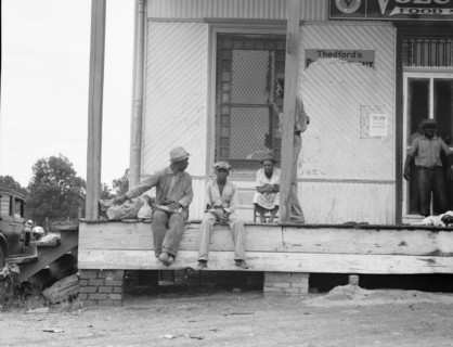 Negroes hanging around the plantation store, Mississippi Delta, 1936. Creator: Dorothea Lange.