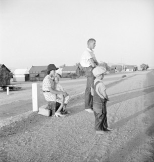 Oklahoma farm family on highway between Blythe and Indio - self-resettlement in California, 1936. Creator: Dorothea Lange.
