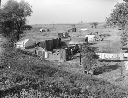 Migrant camp on the outskirts of Sacramento, California on the American River, 1936. Creator: Dorothea Lange.