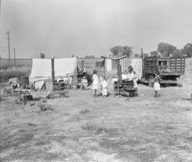 Wife and five children of migratory fruit worker, American River camp on...Sacramento, CA,1936. Creator: Dorothea Lange.