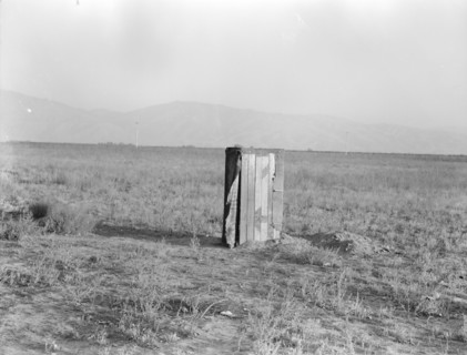 Sanitary facilities for migratory workers, Ditch bank camp, near Arvin, Kern County, CA, 1936. Creator: Dorothea Lange.