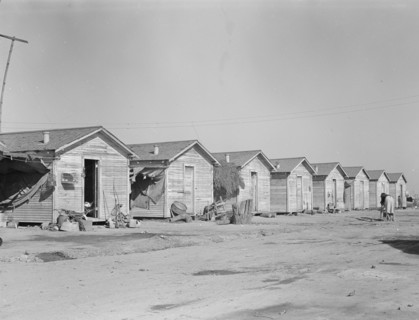 Company housing for cotton workers near Corcoran, California, 1936. Creator: Dorothea Lange.