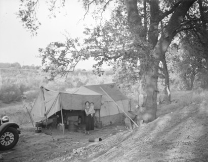 Wife and child of migrant worker, encamped near Winters, California, 1936. Creator: Dorothea Lange.