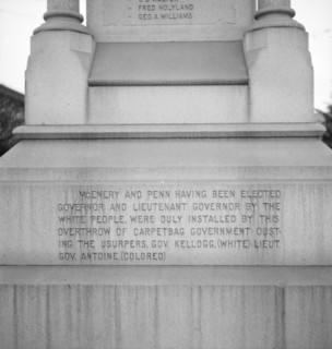 One side of the monument erected to race prejudice, New Orleans, Louisiana, 1936. Creator: Dorothea Lange.