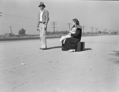 Young family, penniless, hitchhiking on U.S. Highway 99, California, 1936. Creator: Dorothea Lange.