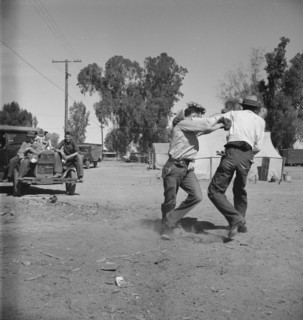 Recreation in a migratory agricultural workers' camp near Holtville, California, 1937. Creator: Dorothea Lange.