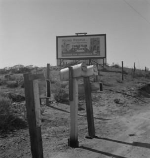 Billboard on U.S. Highway 99, California, 1937. Creator: Dorothea Lange.