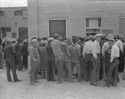 Waiting for the semi-monthly relief checks at Calipatria, California, 1937. Creator: Dorothea Lange.
