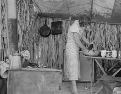 Drought refugee living in a ditch bank camp, Imperial County, California, 1937. Creator: Dorothea Lange.