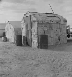 Migratory field worker's home on the edge of a pea field, Imperial Valley, California, 1937. Creator: Dorothea Lange.