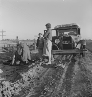 Migratory agricultrual worker family along California highway, U.S. 99, 1937. Creator: Dorothea Lange.