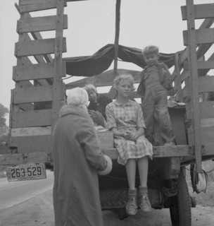 Family of ex-sharecroppers from Arkansas, near Little Rock, on California highway, 1937. Creator: Dorothea Lange.