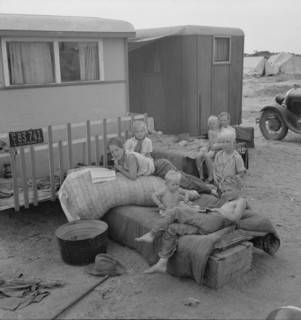 Children from Chickasaw, Oklahoma, in a potato pickers' camp near Shafter, California, 1937. Creator: Dorothea Lange.