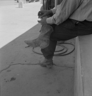 A Texas cattleman is distinguished by the type of boot he wears, Van Horn, Texas, 1937. Creator: Dorothea Lange.