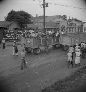 Cotton hoers from Memphis, Tennessee are carried by trucks to the Arkansas plantations, 1937. Creator: Dorothea Lange.