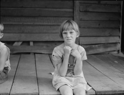 Sharecropper's child whose father receives five dollars a month, Macon County, Georgia, 1937. Creator: Dorothea Lange.