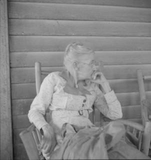 Southern lady of the old school on the veranda...of the Wray Plantation, Georgia, 1937. Creator: Dorothea Lange.