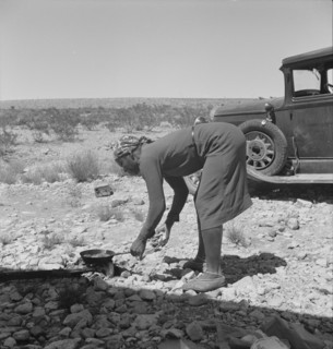 Young Negro wife cooking breakfast, outskirts of El Paso, Texas, 1938. Creator: Dorothea Lange.