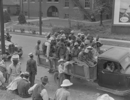 Cotton hoers are transported to the fields daily during the season, Memphis, Tennessee, 1937. Creator: Dorothea Lange.