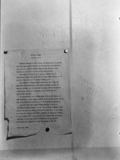 Camp bulletin board in Shafter camp for migratory workers, FSA camp, California, 1938. Creator: Dorothea Lange.
