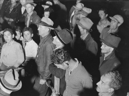 Street meeting at night in Mexican town outside of Shafter, California, 1938. Creator: Dorothea Lange.