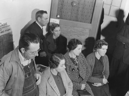 Night meeting in the FSA office, Visalia, Tulare County, California, 1938. Creator: Dorothea Lange.