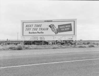 Billboard along U.S. 99...three destitute families...Kern County, CA, 1938. Creator: Dorothea Lange.