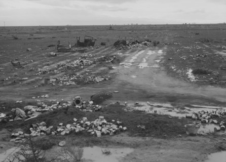 Debris left out on the flats where squatters' camp stood, Kern County, 1939. Creator: Dorothea Lange.
