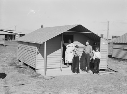 Migrant family from Oklahoma, first occupants of Westley camp, California, 1939. Creator: Dorothea Lange.