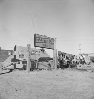 Living conditions for migratory laborers in private auto camp, Calipatria, Imperial County, 1939. Creator: Dorothea Lange.