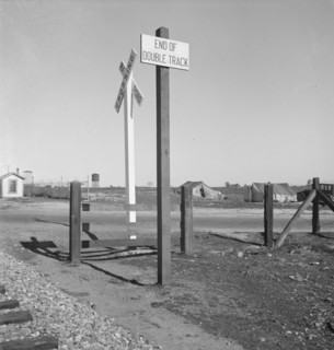 Migrants' tents...along the right of way of the southern pacific, near Fresno, California, 1939. Creator: Dorothea Lange.
